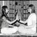 May be an image of 2 people and people practising yoga